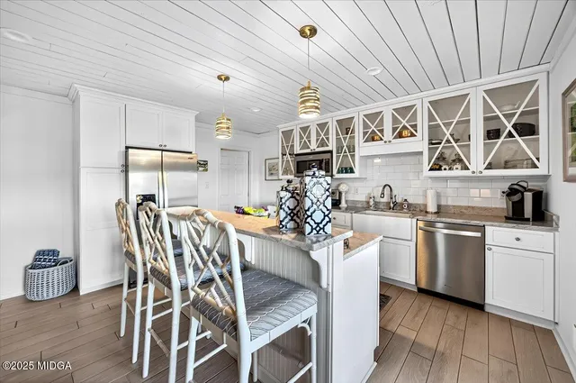 an aerial view of a house with a lake view