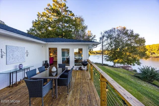 a view of a house with backyard porch and sitting area