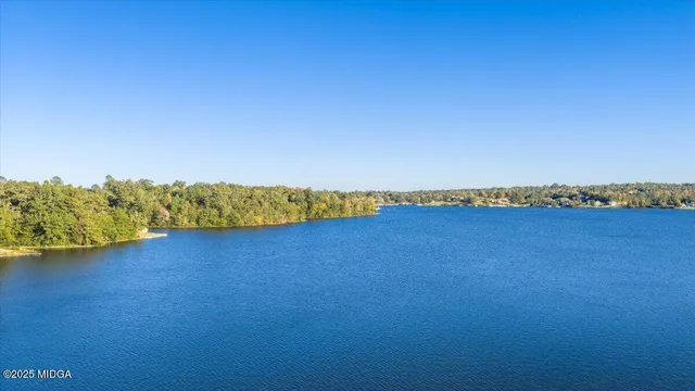 a view of a house with a yard balcony and sitting area