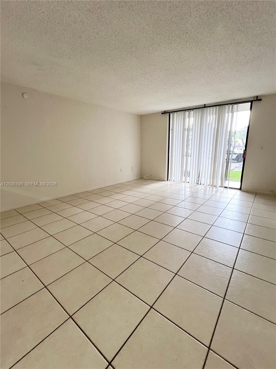 8400 Southwest 133rd Avenue Road, Unit 121 Miami, FL 33183 - Photo 41 of 43 a view of an empty room and a window
