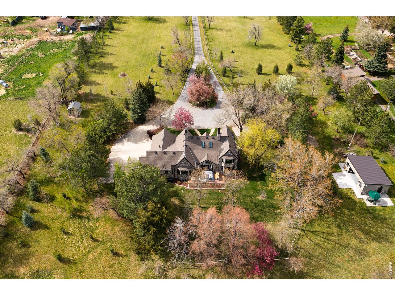 5575 St Vrain Road Longmont, CO 80503 - Photo 1 of 50 10 acre estate. Abundant, flowing water. Apple orchard. Boutique outbuilding / workshop / garage. Potential ADU, barn, guest house.