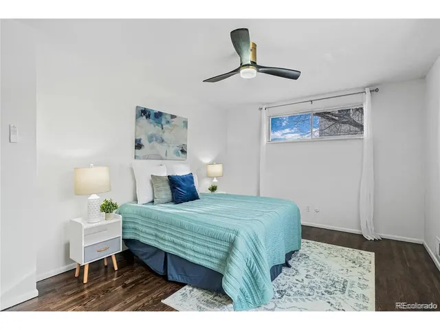 a bedroom with a bed and a table in it