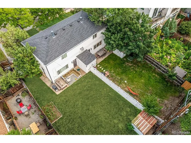 a aerial view of a house with a yard