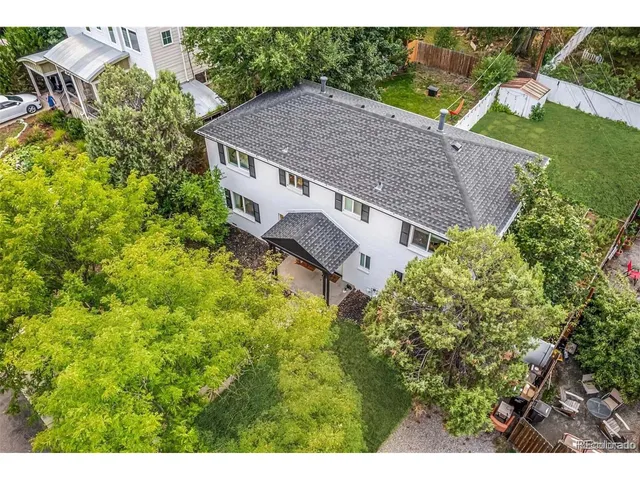 a aerial view of a house with a yard and plants