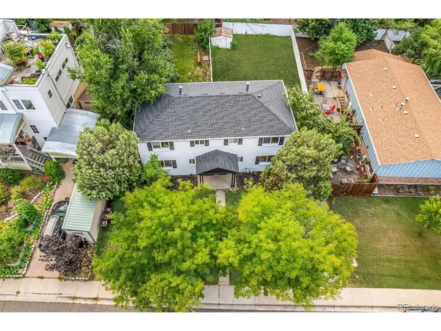 an aerial view of a house with a garden