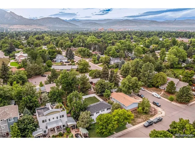 an aerial view of residential house with an outdoor space