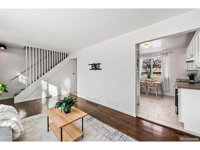 a view interior of livingroom and dining room with wooden floor