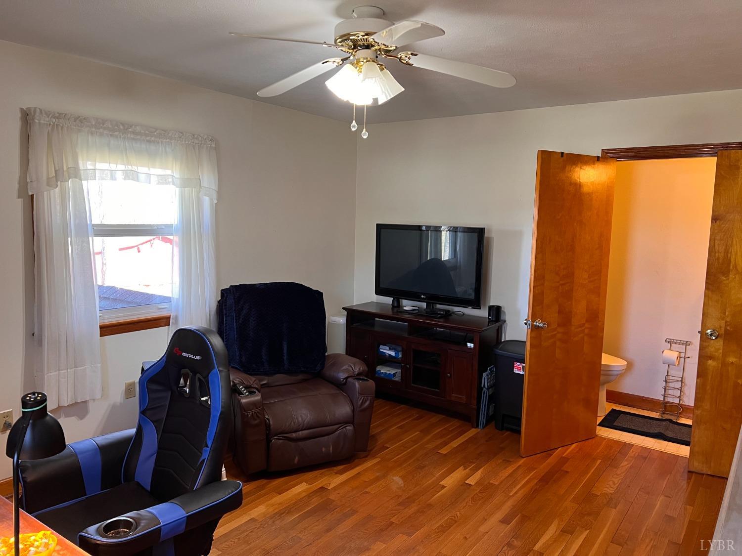 1930 Homeplace Road Rustburg, VA 24588 - Photo 35 of 88 a living room with furniture and a flat screen tv