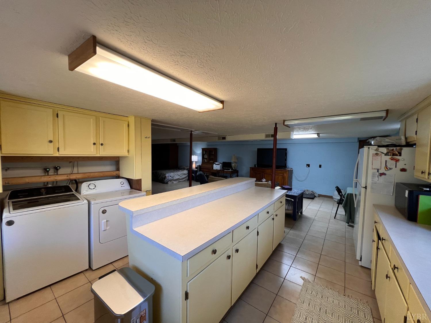 1930 Homeplace Road Rustburg, VA 24588 - Photo 49 of 88 Below grade full kitchen. Refrigerator and oven convey. Washer and dryer do not convey.