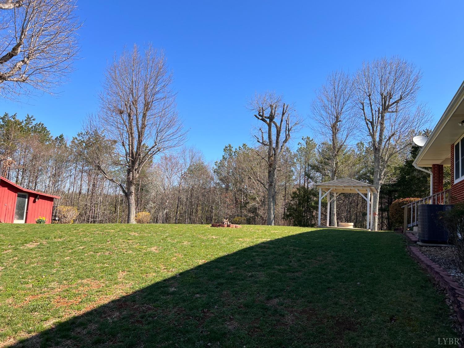 1930 Homeplace Road Rustburg, VA 24588 - Photo 59 of 88 a view of an house with garden space and trees