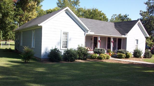 10241 Viola Road Morrison, TN 37357 - Photo 1 of 20 a view of a house with backyard and garden