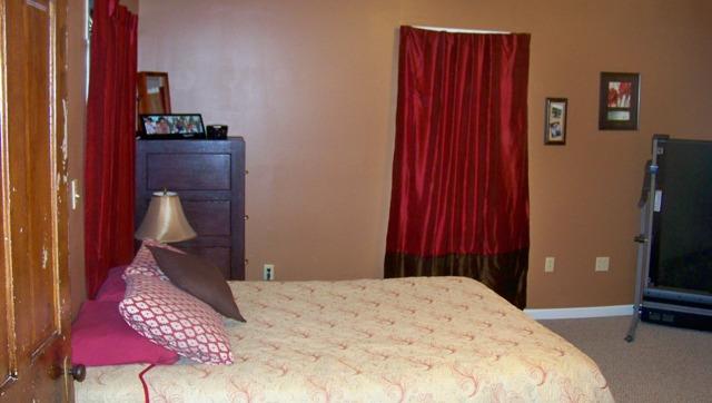 10241 Viola Road Morrison, TN 37357 - Photo 5 of 20 a bedroom with a bed and a lamp