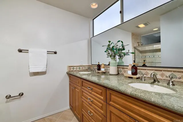 a bathroom with a shower and a sink