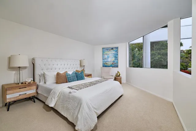 a bathroom with a granite countertop sink a large mirror and a shower