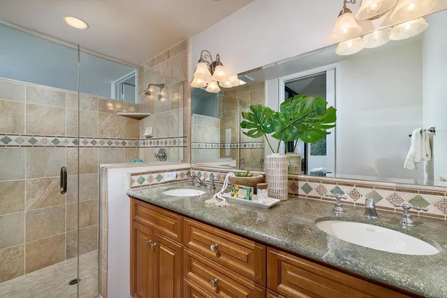 a dining room with furniture and a potted plant
