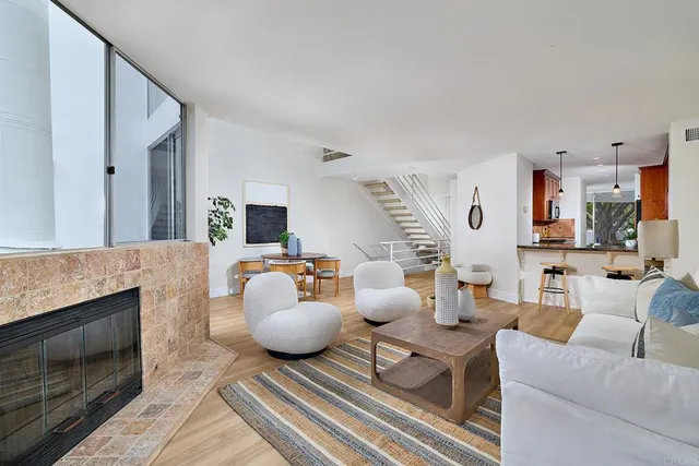 a dining room with furniture and wooden floor