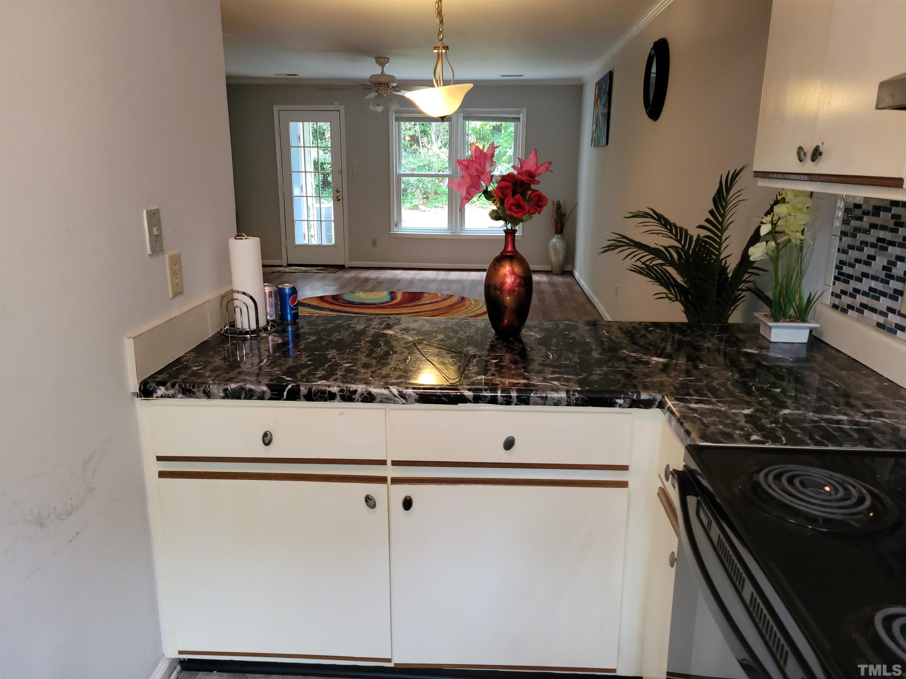 4362 Bona Court Raleigh, NC 27604 - Photo 14 of 17 a kitchen with a refrigerator and a stove