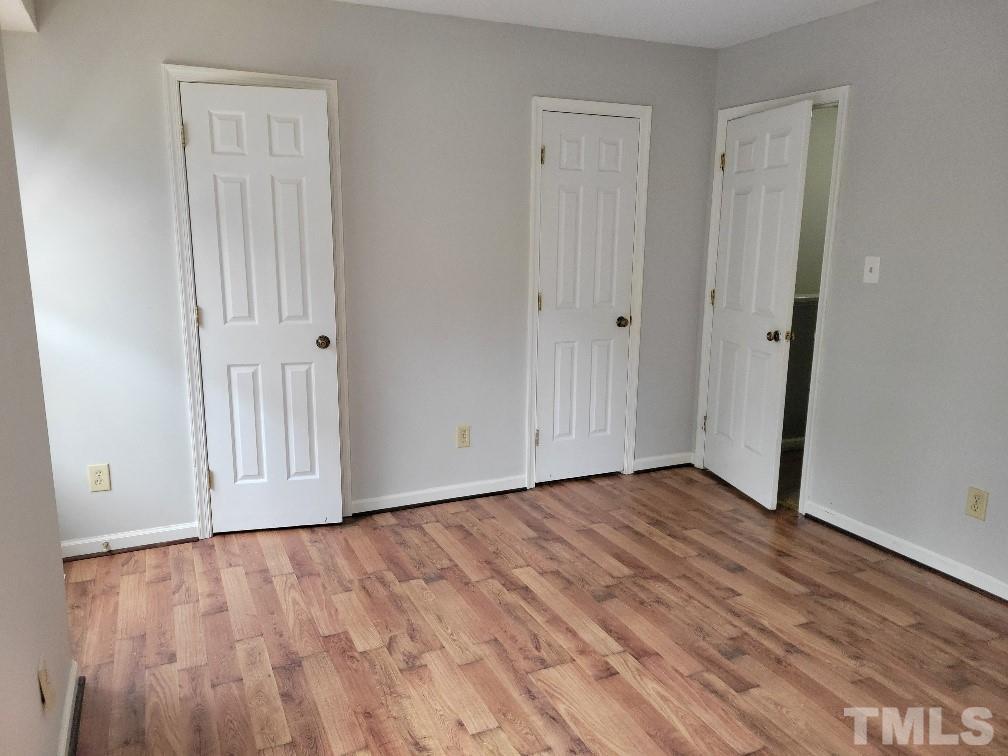 4362 Bona Court Raleigh, NC 27604 - Photo 6 of 17 a view of an empty room with wooden floor