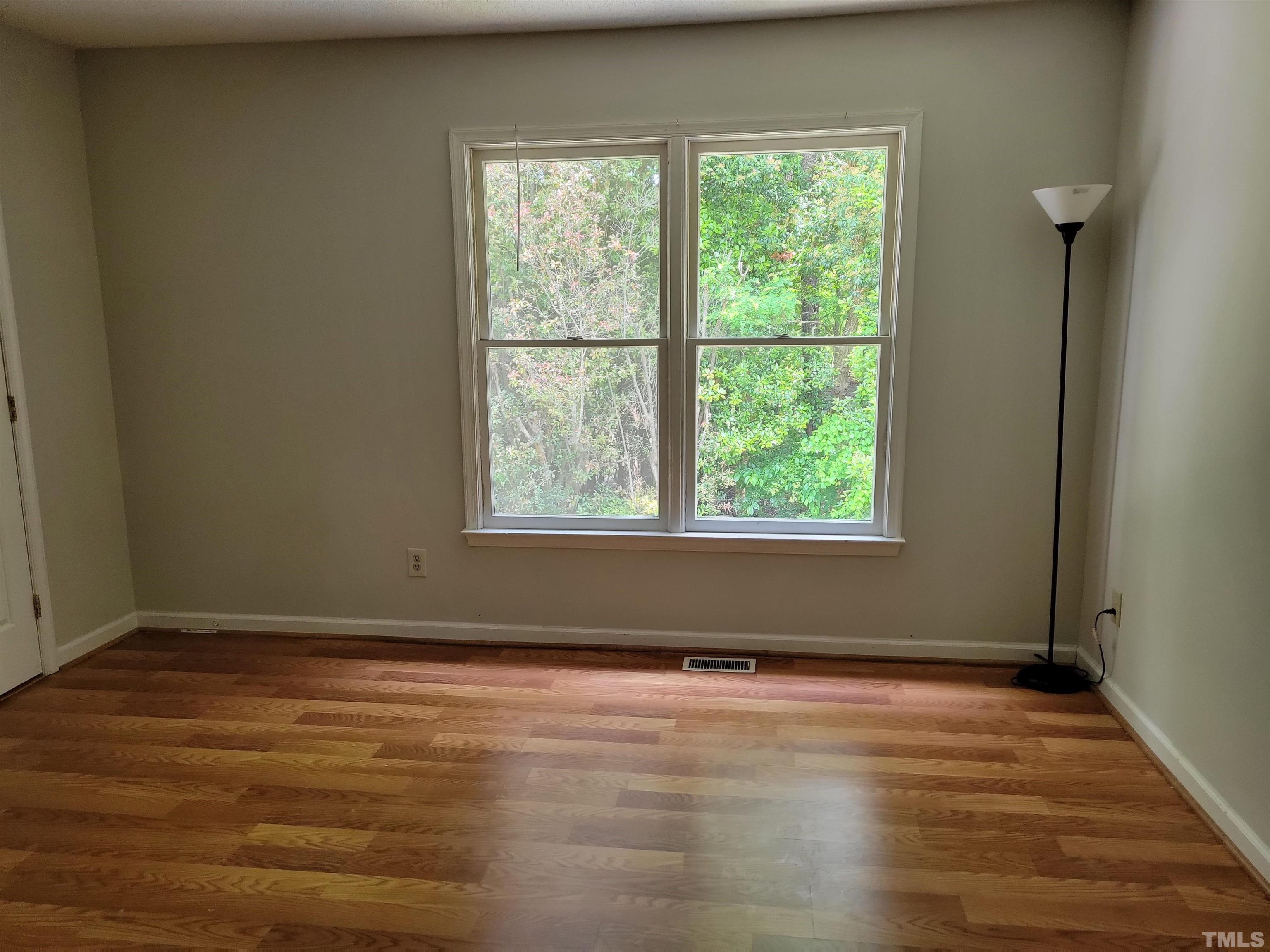 4362 Bona Court Raleigh, NC 27604 - Photo 8 of 17 an empty room with wooden floor and windows