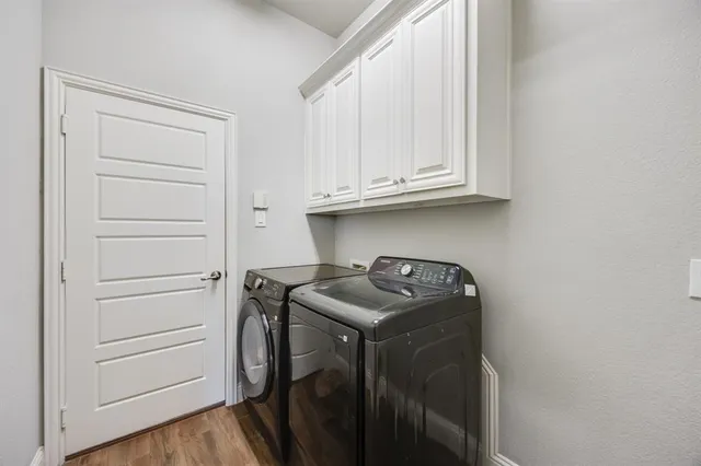 a utility room with washing machine