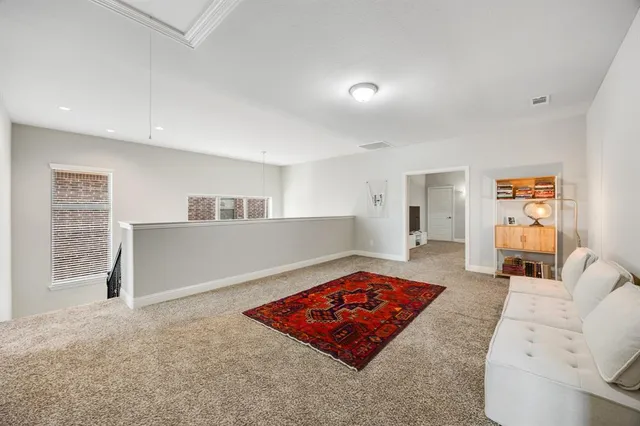 a living room with furniture and a rug