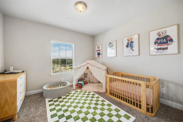 a bedroom with furniture and a window