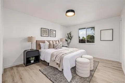 a bedroom with a bed and window