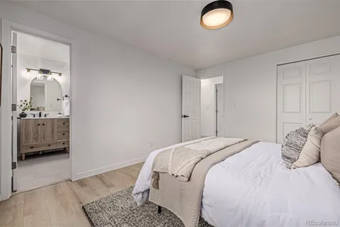 a bedroom with a bed and a couch