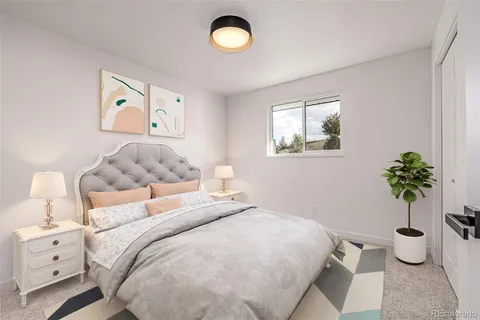 a bedroom with a bed and a potted plant