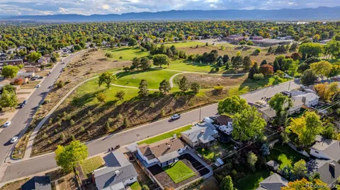 an aerial view of a house with a swimming pool