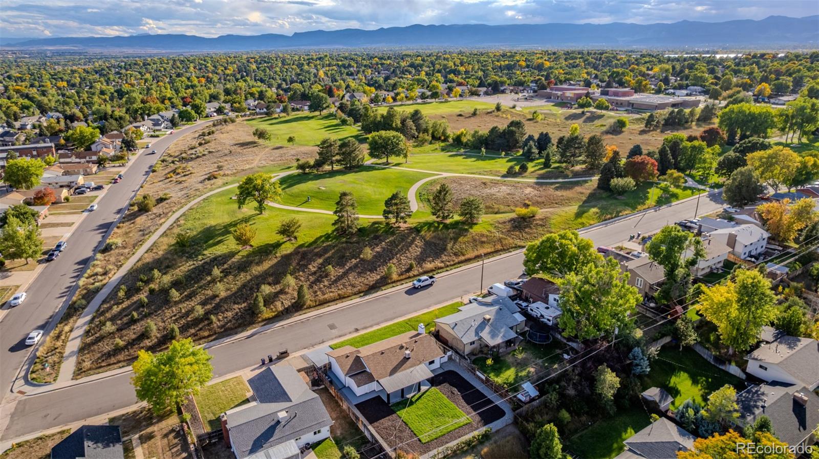 3831 West Rutgers Place Denver, CO 80236 - Photo 2 of 35 an aerial view of a house with a swimming pool