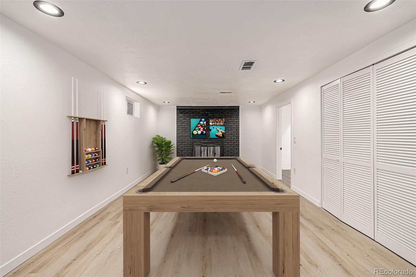 3831 West Rutgers Place Denver, CO 80236 - Photo 23 of 35 a view of entryway with a wooden floor