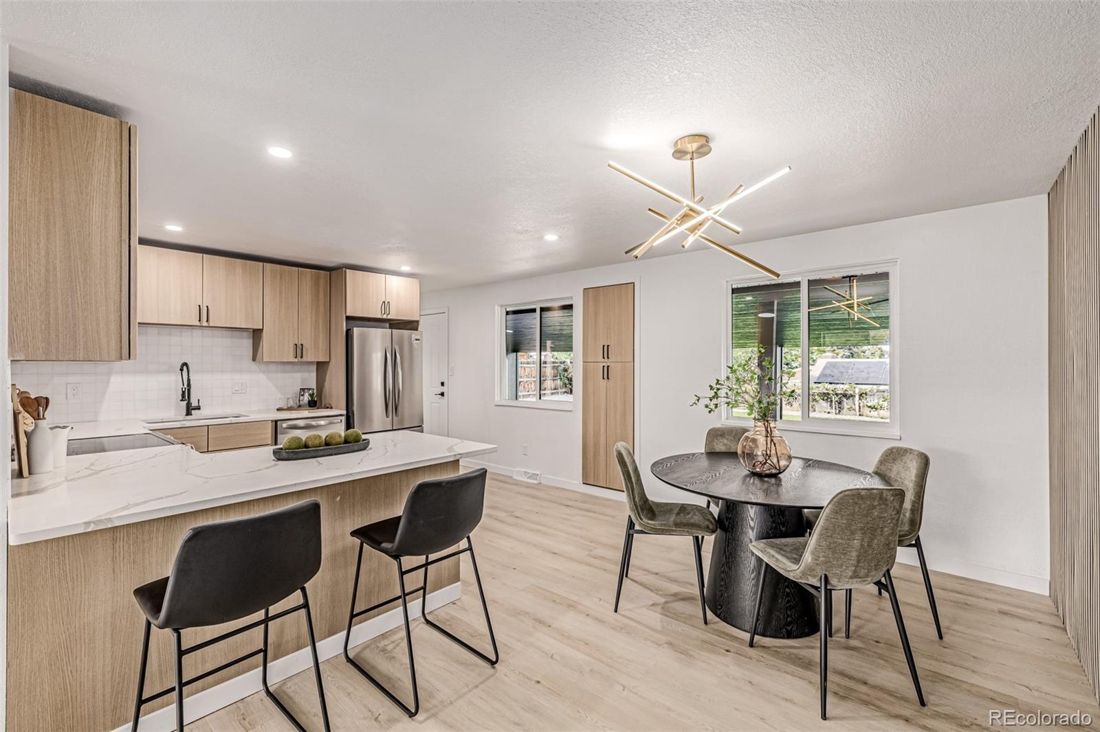 3831 West Rutgers Place Denver, CO 80236 - Photo 5 of 35 a dining room with furniture and window