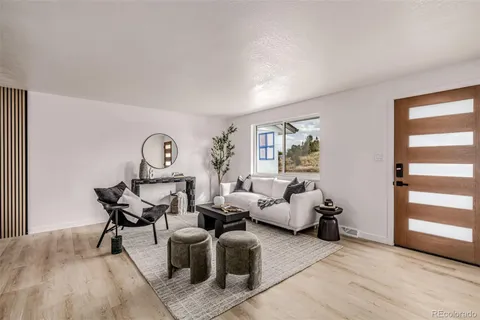 a view of a livingroom with furniture and windows