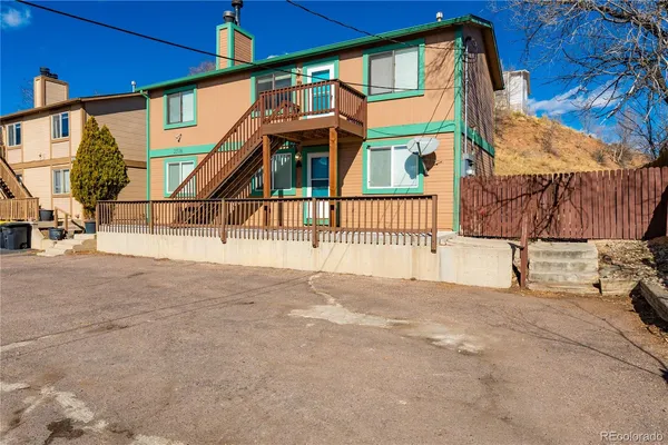 a view of a house with a street