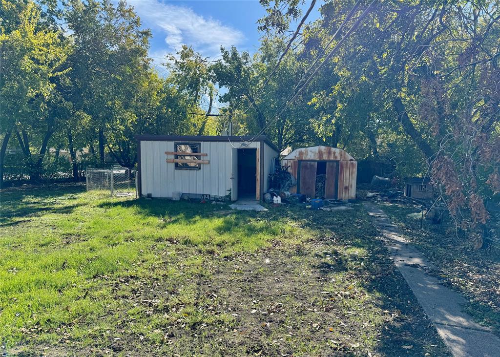 3654 Fontana Drive Dallas, TX 75220 - Photo 6 of 6 View of yard featuring a storage unit