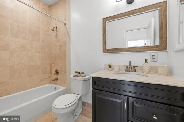a bathroom with a toilet and a bathtub