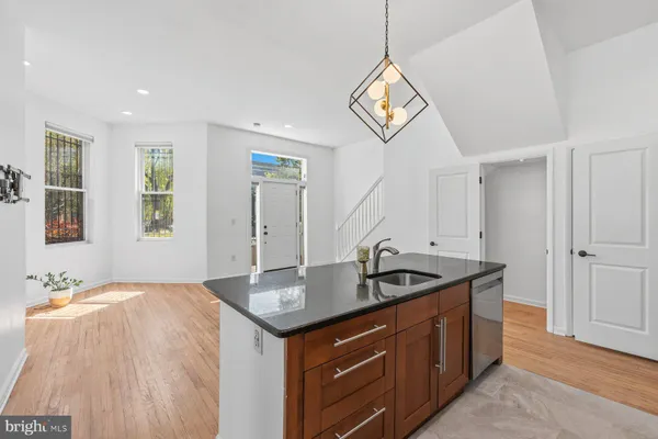 a kitchen with a sink and a refrigerator