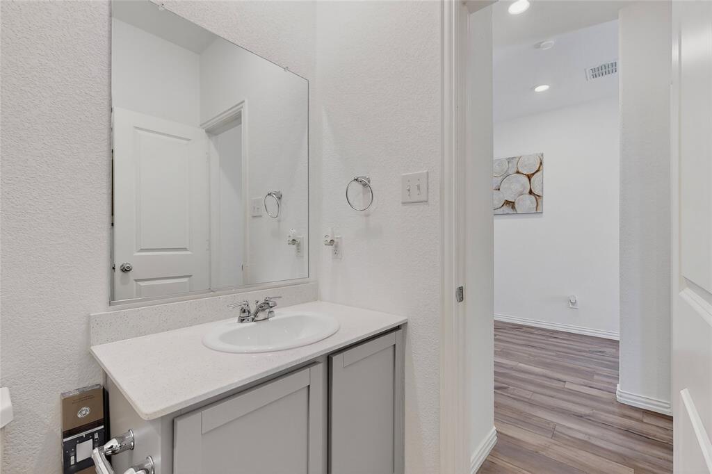 444 Ranchito Pass Fort Worth, TX 76052 - Photo 22 of 24 a bathroom with a sink a shower and a mirror