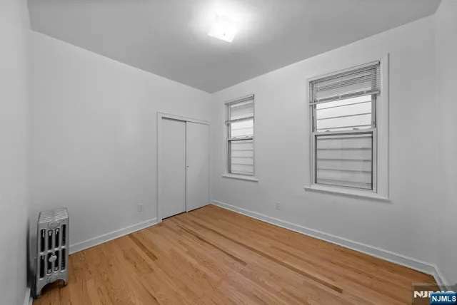 a room with a bed and a window