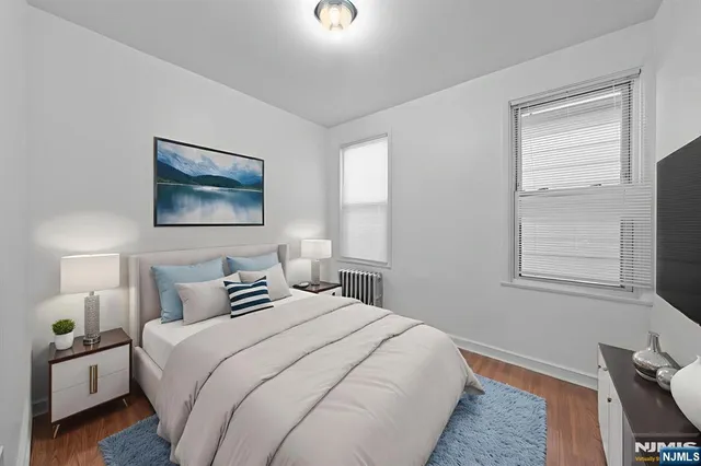 a bedroom with bed and window