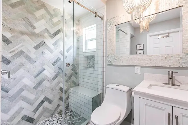 a bathroom with a sink toilet and shower