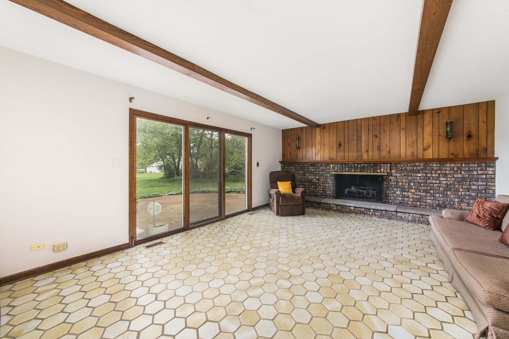 1701 Banbury Road Inverness, IL 60067 - Photo 15 of 33 a view of a livingroom with furniture and a fireplace