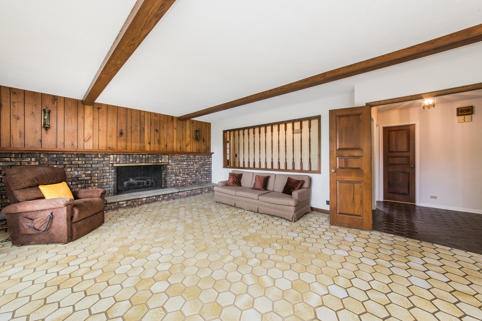 1701 Banbury Road Inverness, IL 60067 - Photo 16 of 33 a living room with furniture and a fireplace