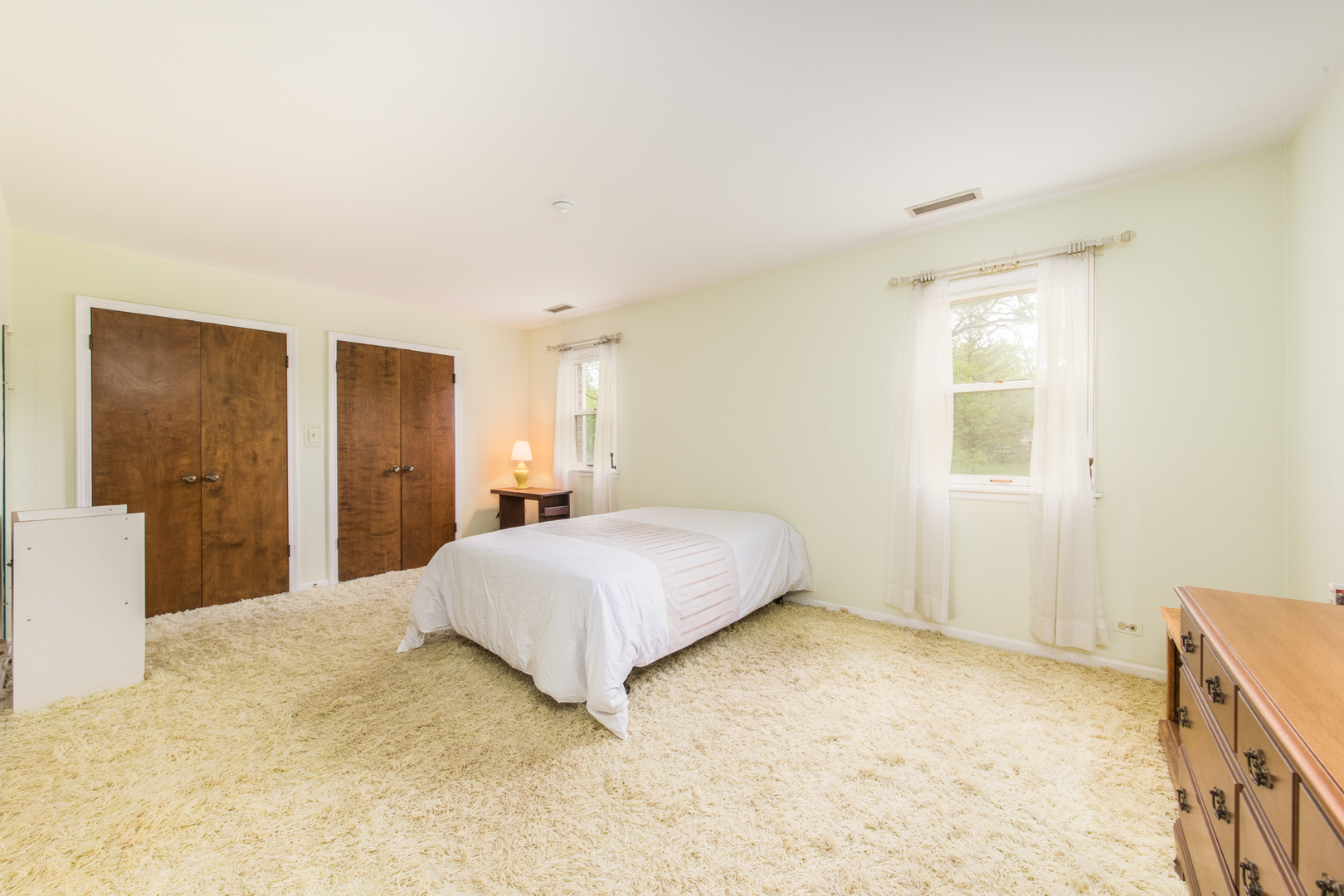 1701 Banbury Road Inverness, IL 60067 - Photo 20 of 33 a bedroom with a bed and a cabinets