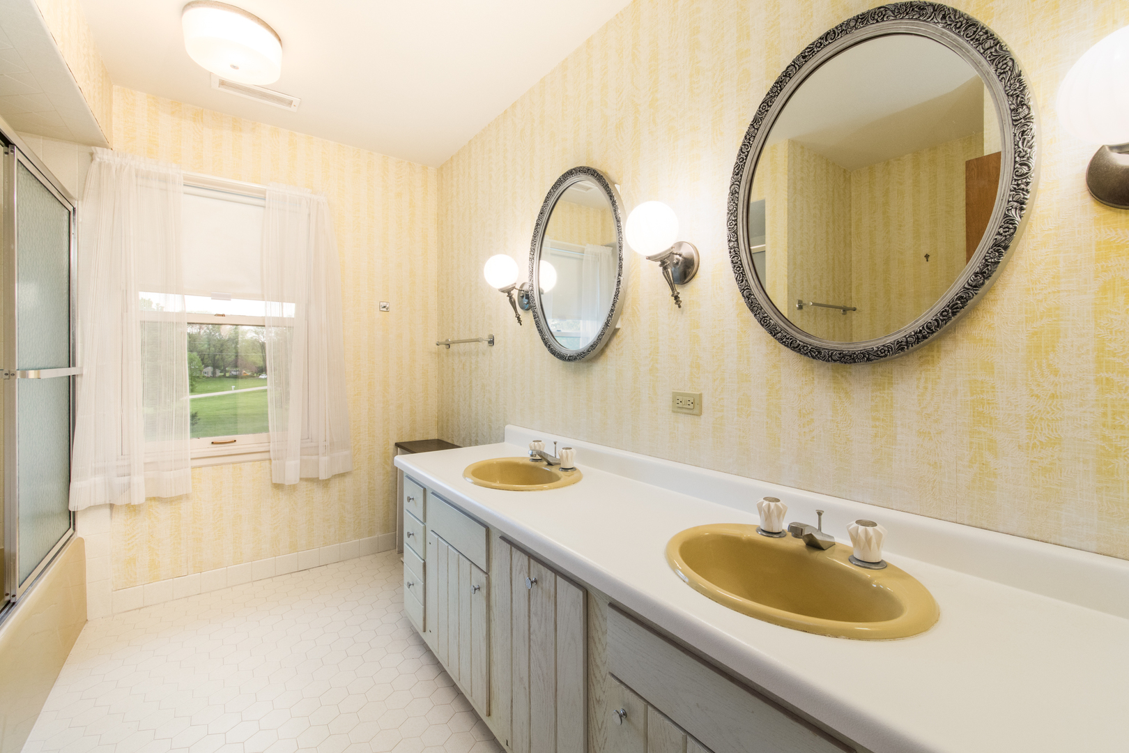 1701 Banbury Road Inverness, IL 60067 - Photo 23 of 33 a bathroom with a sink and a mirror