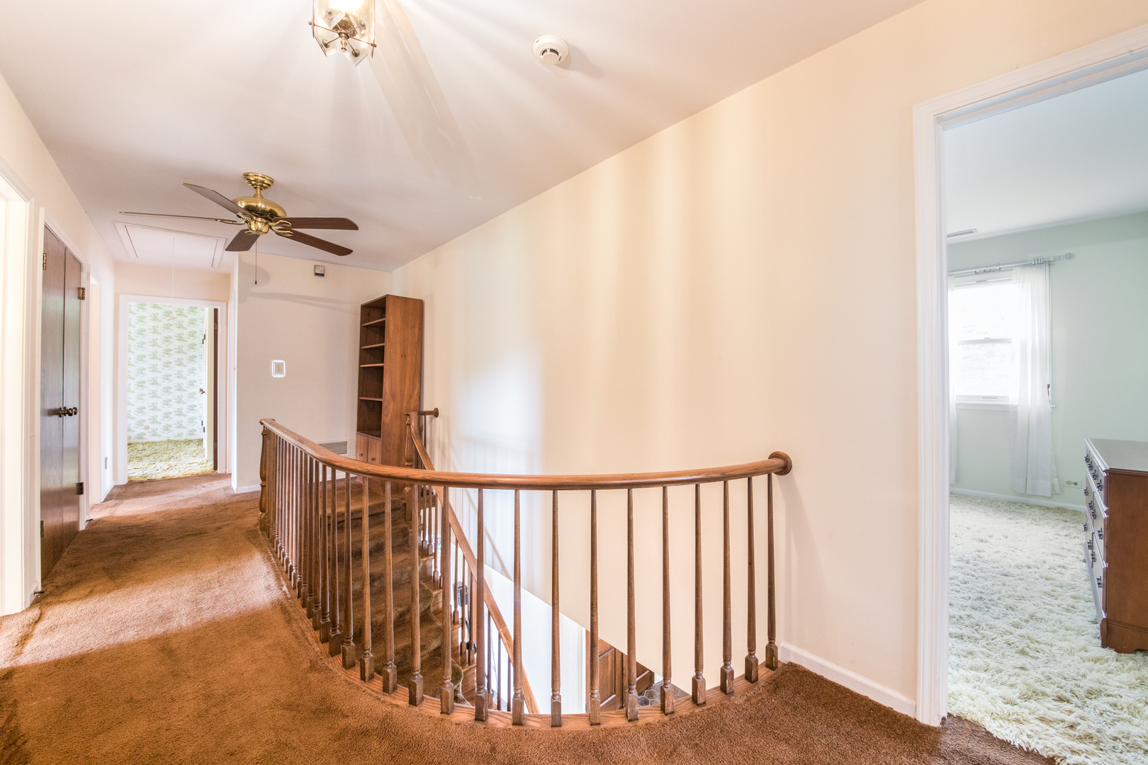 1701 Banbury Road Inverness, IL 60067 - Photo 27 of 33 a view of a hallway with a ceiling fan