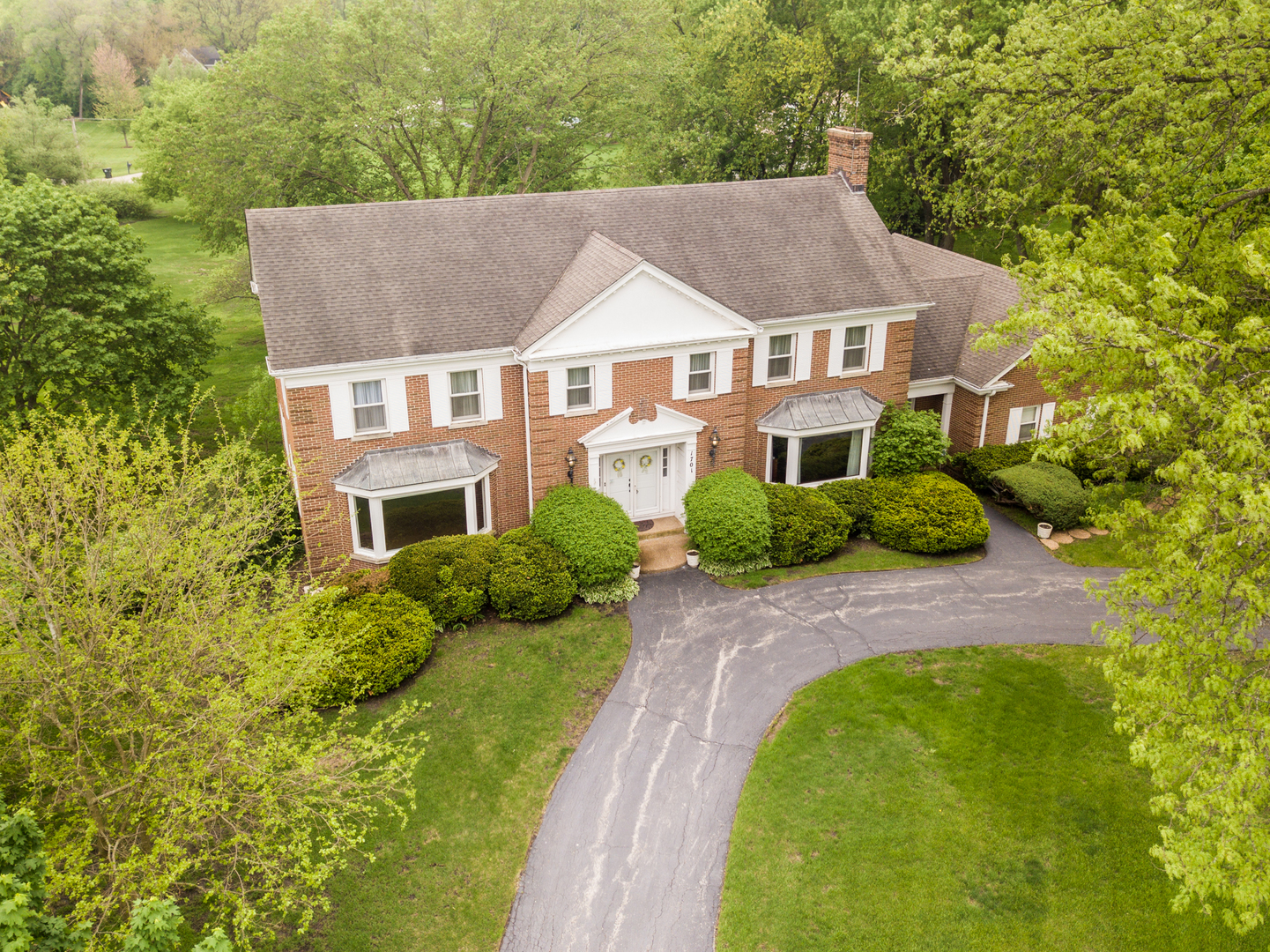 1701 Banbury Road Inverness, IL 60067 - Photo 33 of 33 a aerial view of a house with swimming pool and garden