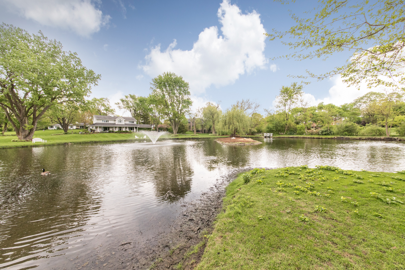 1701 Banbury Road Inverness, IL 60067 - Photo 5 of 33 a view of a lake with houses in the back