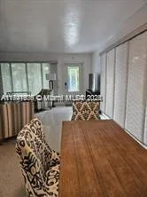 a bed sitting in a room next to a window